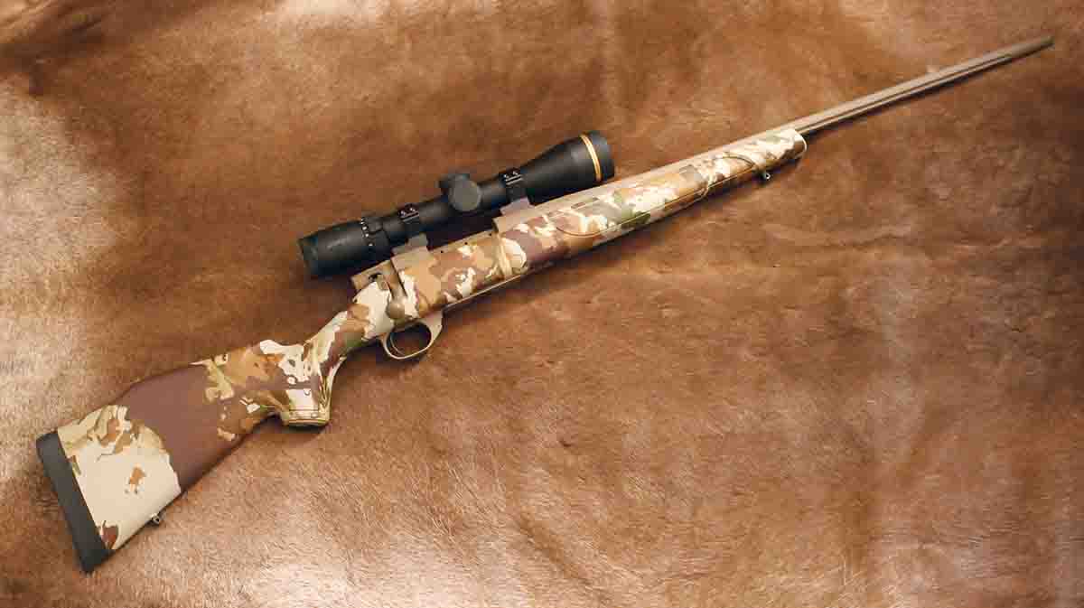 The Vanguard First Lite is a very twenty-first-century hunting rifle, with a synthetic stock painted in a computer-generated pattern, and Cerakoted metal, including a fluted barrel.
